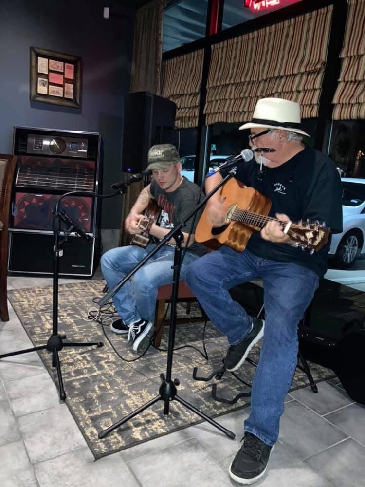 Kokomo Joe performing a duet with another guitarist